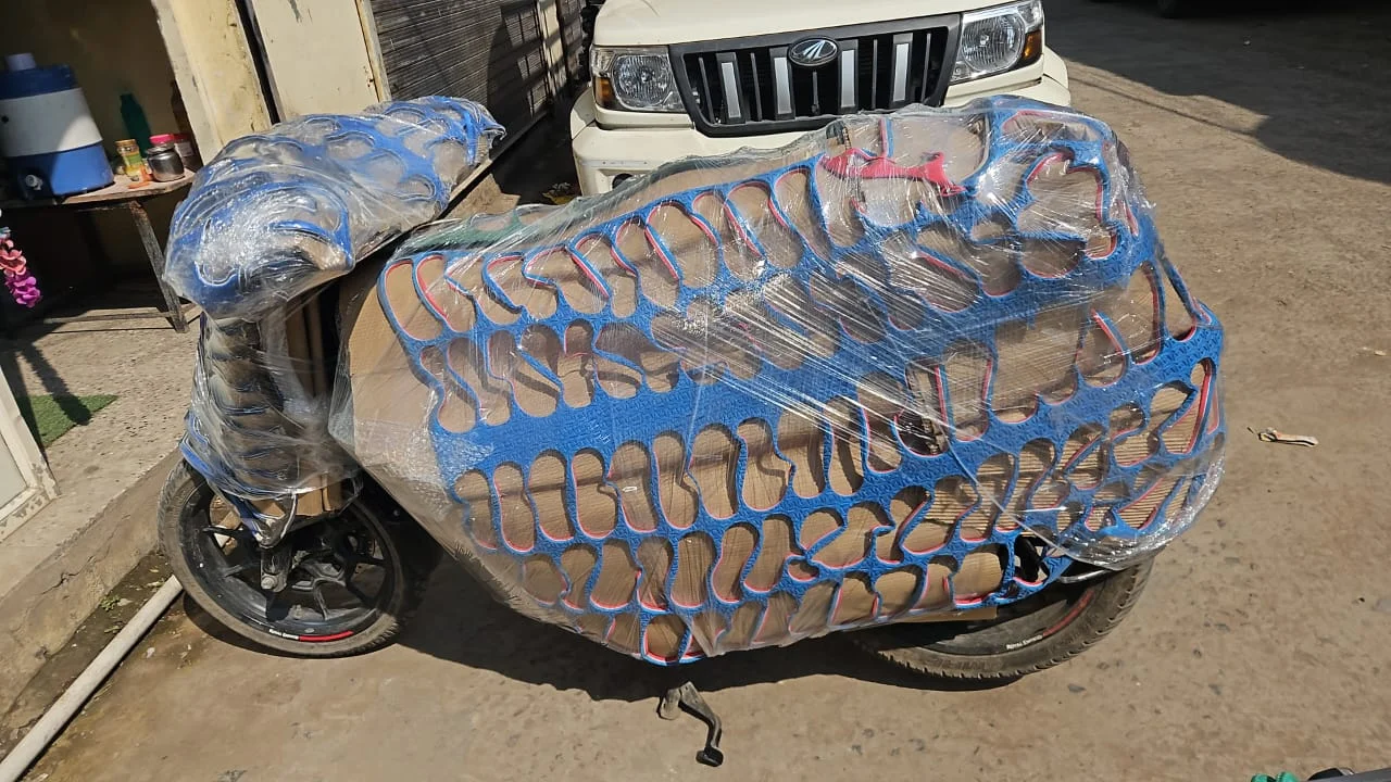 Two-wheeler motorcycle protected with shock-absorbing foam netting