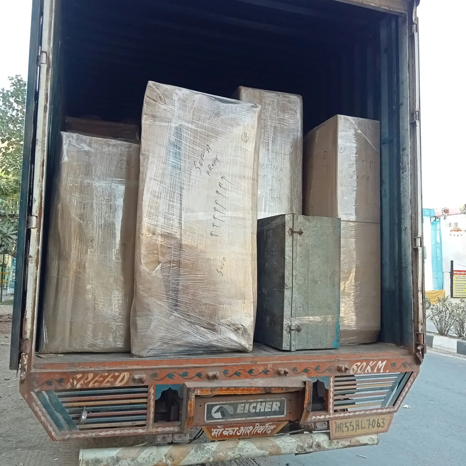 Goods loaded systematically for highway transit in Eicher cargo truck