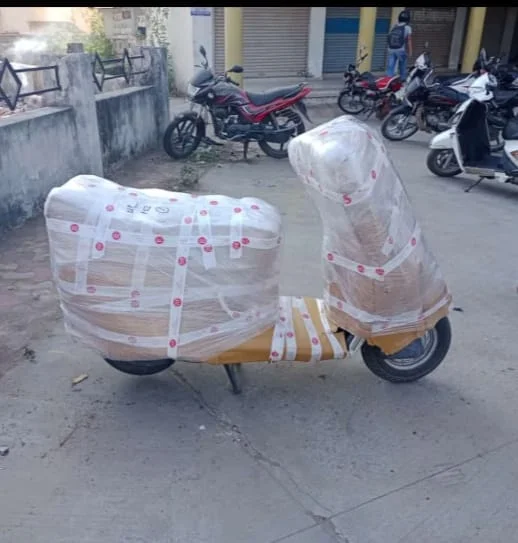 Two-Wheeler Packed with Red Security Seals - Jalsa Packers & Movers Vadodara